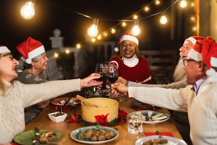 Senior group of friends toasting to the holidays in Whiting.